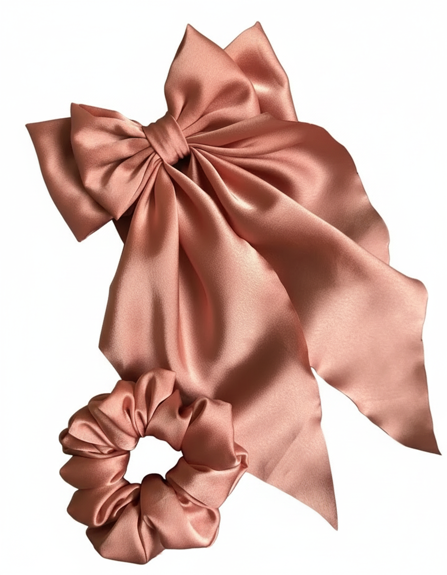 Rose gold bow and scrunchie on white background